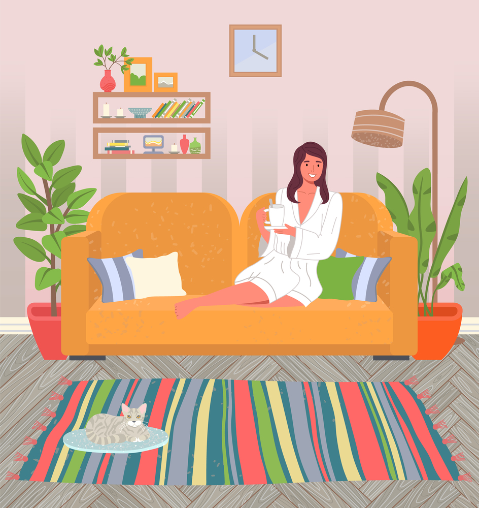 Cozy home interior of the living room. Young girl in white coat is sitting on yellow sofa with cup of tea. Decorative couch pillow. Potted plants, cat on mat. Book shelf, striped rug. Rest at home. Girl at home on the couch, in a bathrobe and with a mug of tea. Cat on the mat. Cozy house