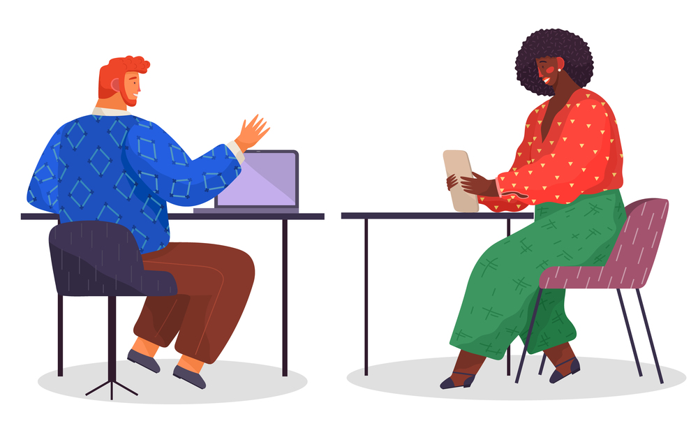 Red-haired bearded man, back view, in blue sweater, sits at table with laptop and talks to dark-skinned woman holds tablet, wears red blouse, green pants. Employees in office work and communicate. Man uses laptop and talks to woman with tablet. Office employees communicate at workplace.