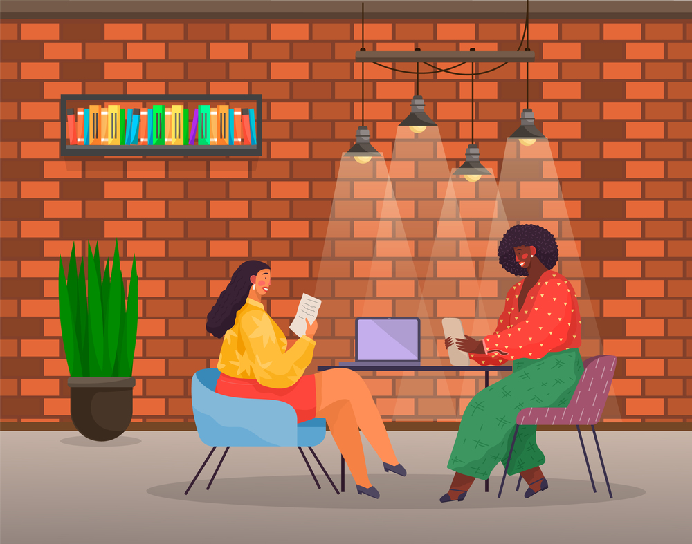 Women sitting at table with laptop. Long-haired woman in chair reading document, dark-skinned girl holding tablet. Modern office, red brick wall, potted plant, ceiling lighting. Business meeting. Business women, partners in office, business meeting, modern devices, cozy office room. Flat image