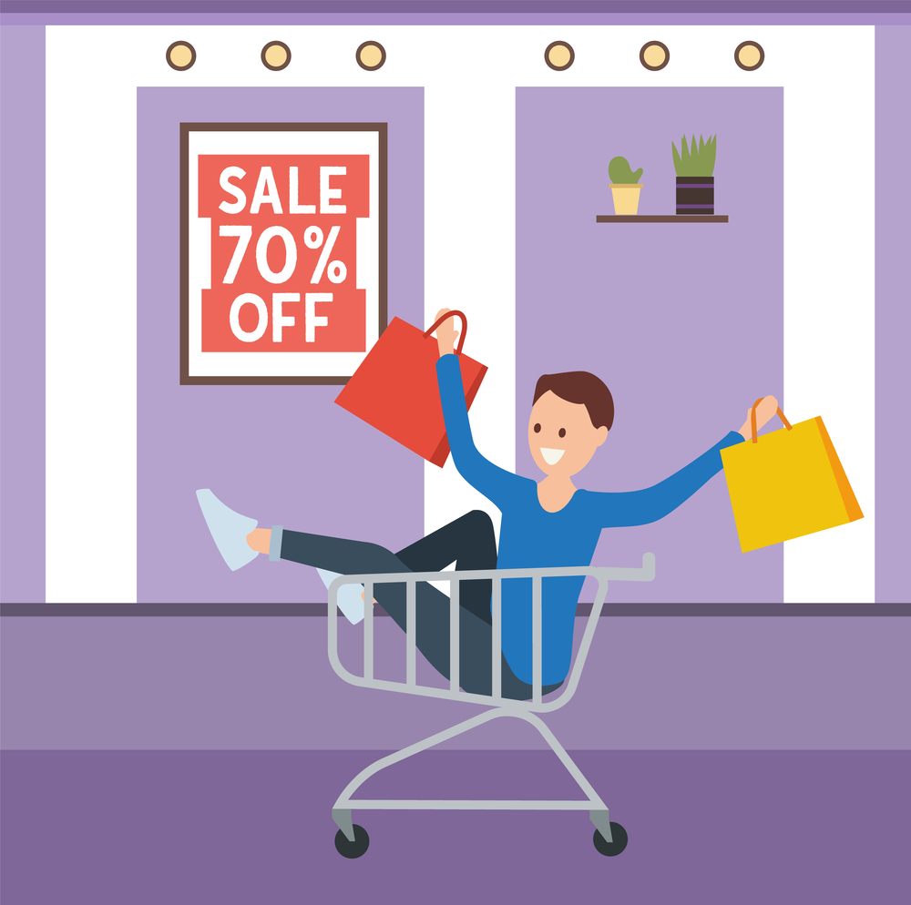 Man with shopping bags in his hands is smiling. Young handsome fashion shopper guy is rolling in the shopping cart. Male character with packages during a seventy percent discount in the boutique. Young fashion shopper guy is rolling in the shopping cart. Man with purchases during a sale in store
