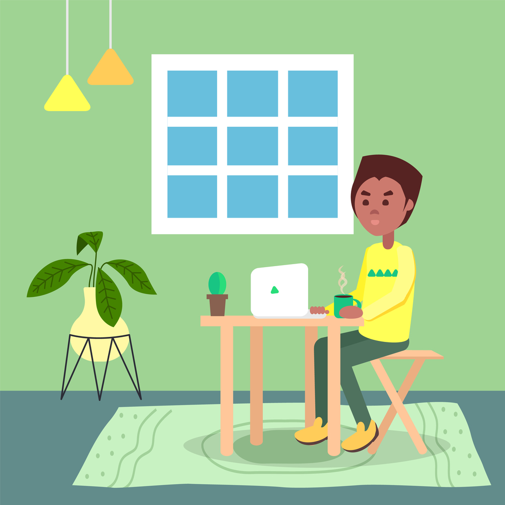 Black man with hot coffee on table sitting and using laptop. Quarantine distance work. Freelance work at home. Effectively organizing home time. Home office. Young guy working online, freelancer. Black man sitting at table using laptop, work at distance, remotely working, quarantine isolation