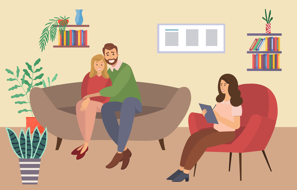 A man and a woman are sitting on a large brown sofa. The psychologist is sitting with a paper and asking questions. Married couple sitting on the couch together with happy psychotherapy session. A man and a woman are sitting on a large sofa. The psychologist sits with a paper and asks questions