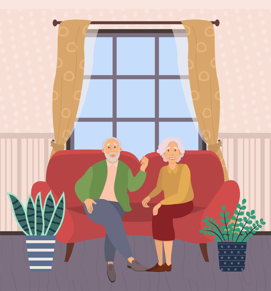 Old man and woman are sitting on a large red sofa. Elderly people are smiling against the background of the window. Married couple is sitting on the couch. Happy relatives spend time together. Old man and woman are sitting on a large sofa. Elderly people are smiling against the window