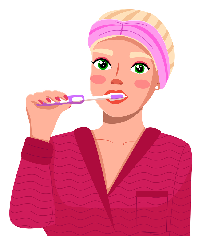 Young caucasian blonde woman brushing her teeth. Female taking care of her teeth on white background. Happy girl wearing pink bathrobe with toothbrush in hand cleaning teeth doing mouth hygiene. Young caucasian blonde woman brushing her teeth. Female taking care of her teeth on white background