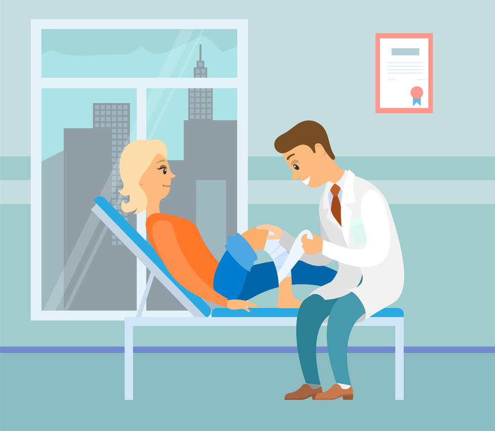 Patient with injured leg on a consultation with a doctor. Orthopedist puts a bandage on the knee of a girl. Woman lies on the bed and looks at the man. Medical ward in the hospital with city landscape. Orthopedist puts bandage on a knee. Patient and doctor in the medical ward in the hospital