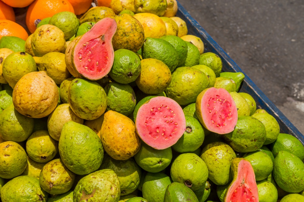 Pile of jocote fruits or mombin hog plum and sineguela sold at a local fresh market in San Jose Costa Rica