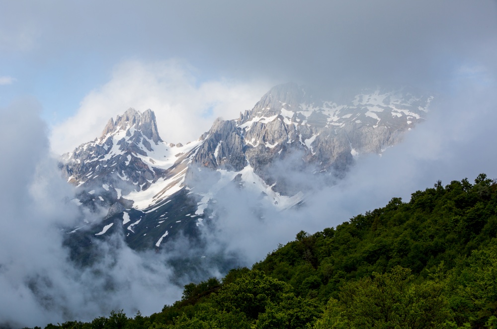 Mountain landscape in the Picos de Europa national park, Spain, Asturias. Snow on the mountain peaks.