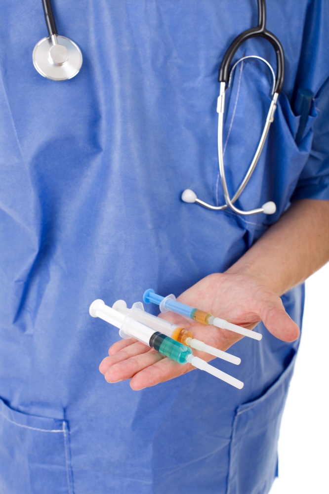 Closeup photo of a male doctor holding syringes