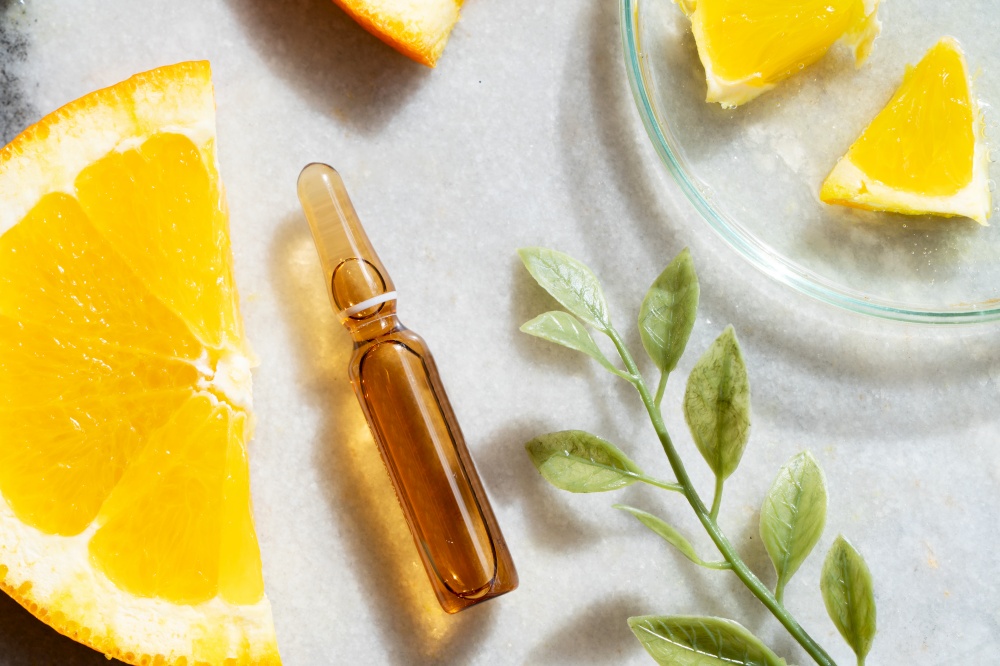 Citrus fruit vitamin c serum oil beauty care, anti aging natural cosmetic, laboratory testing concept, close up view. Citrus fruit vitamin c serum oil beauty care