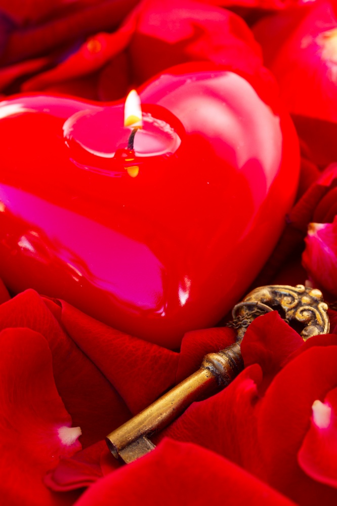 Key with the burning candle heart as a symbol of love,. Key with the heart as a symbol of love