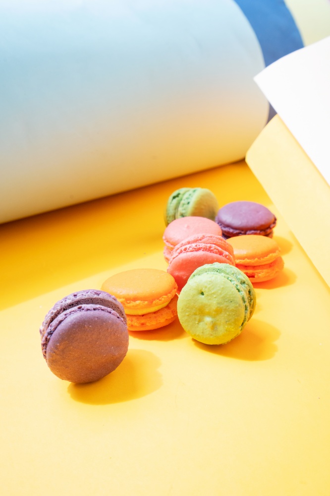 french cookies macaroons on gray and illuminating yellow background. french cookies macaroons