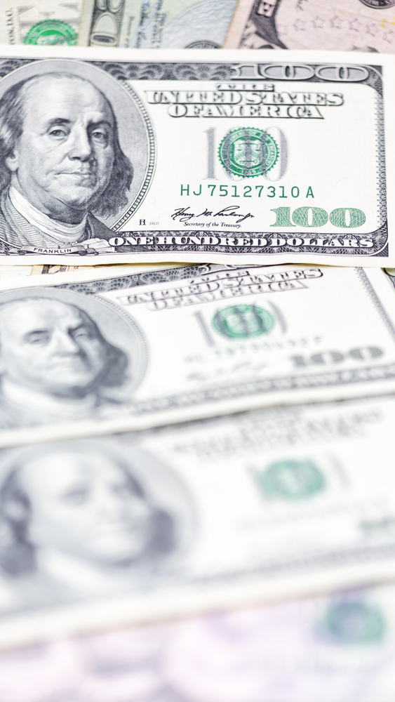 blurred dollar money background like concept of success prosperity and business