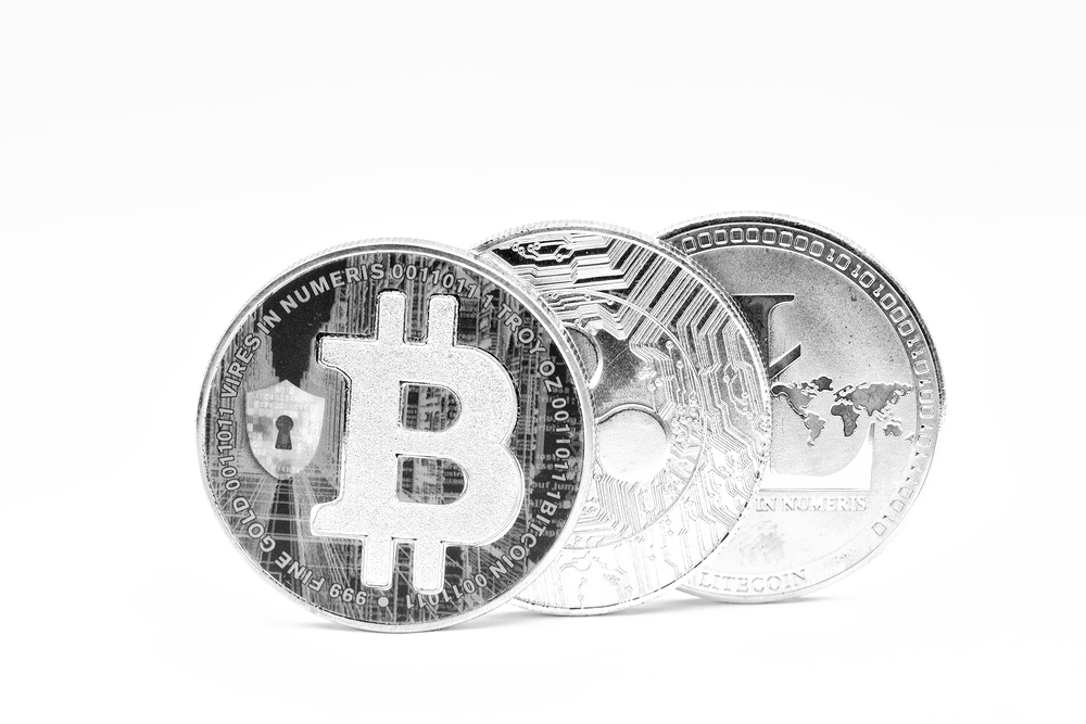in the white background and copy space the coin of bitcoin litecoin and ripple  like concept of future and investment