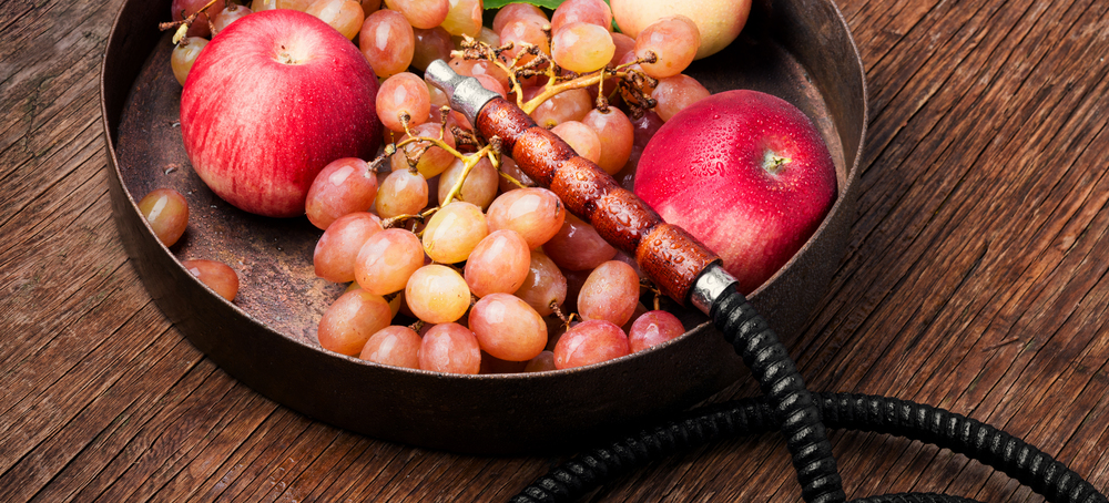 Turkish smoking hookah with taste of a fruit mixture of grapes and apples.Shisha concept. Fruit taste of hookah.. smoke hookah with grapes