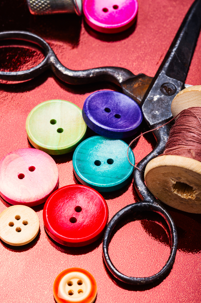 Bright assorted sewing buttons in mix colors. Multicolored decorative buttons
