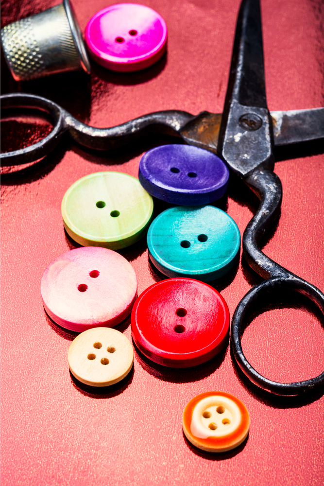 Bright assorted sewing buttons in mix colors. Set of tailoring accessories