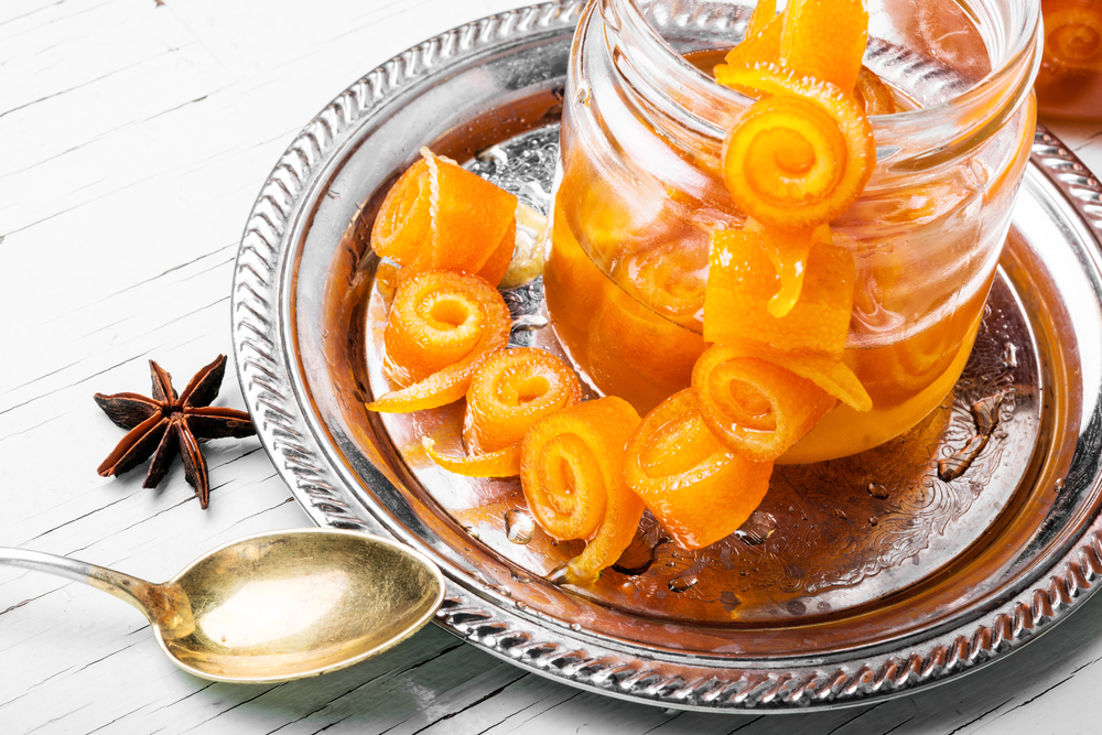 Closeup on jar with orange jam.Candied orange peel. Orange jam in glass jar