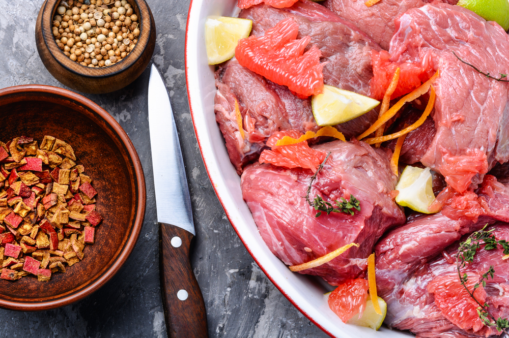 Pieces of raw beef steaks.Raw sliced meat.Citrus marinade.Raw meat. Raw chopped meat with citrus