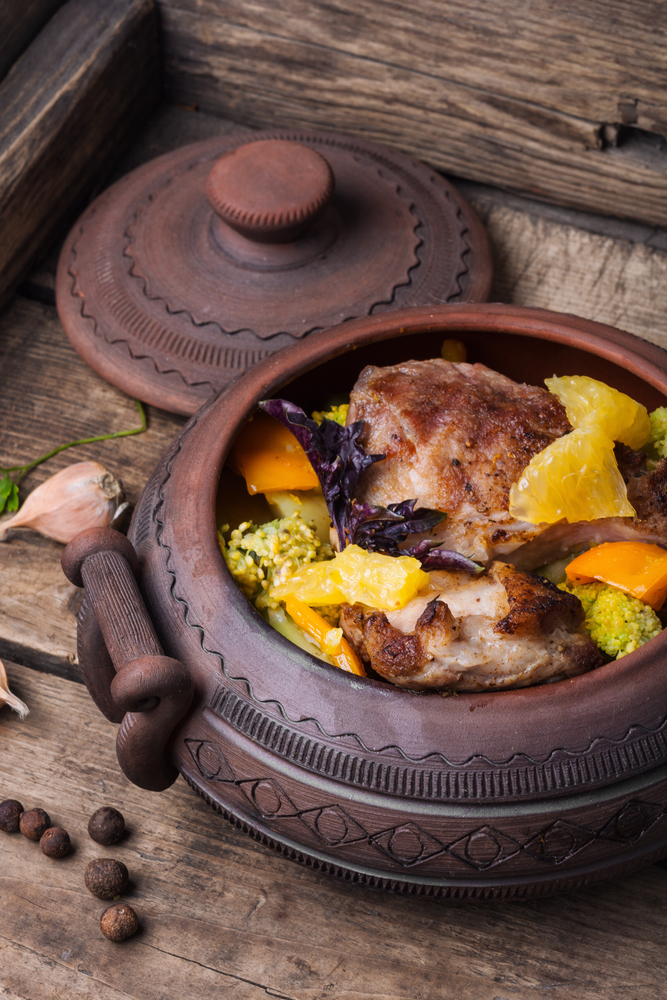 Baked meat with vegetables in clay pots. Rural recipe meat