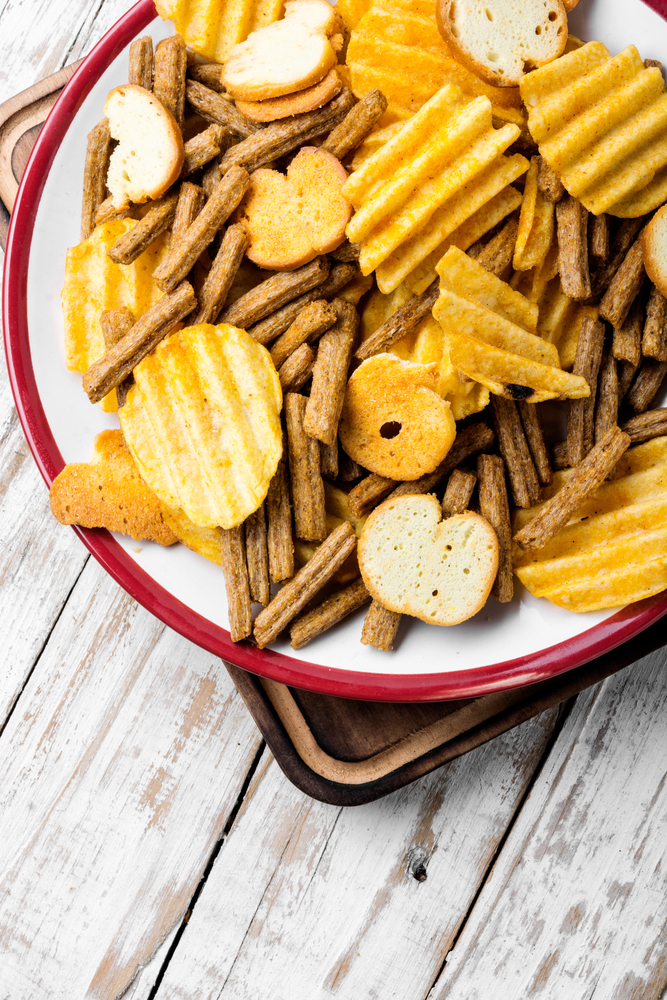 Crispy potato chips in bowl.Homemade potato chips. Salty snacks,potato chips