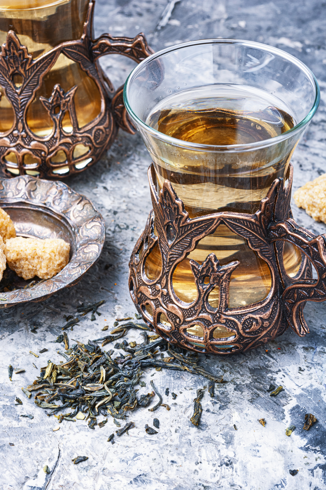 Eastern tea in traditional glasse.Eastern tea concept. Turkish tea in traditional glass