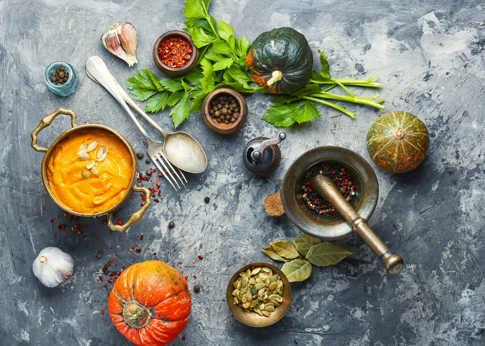 Vegetarian autumn pumpkin cream soup.Pumpkin soup and organic pumpkins. Pumpkin vegan soup
