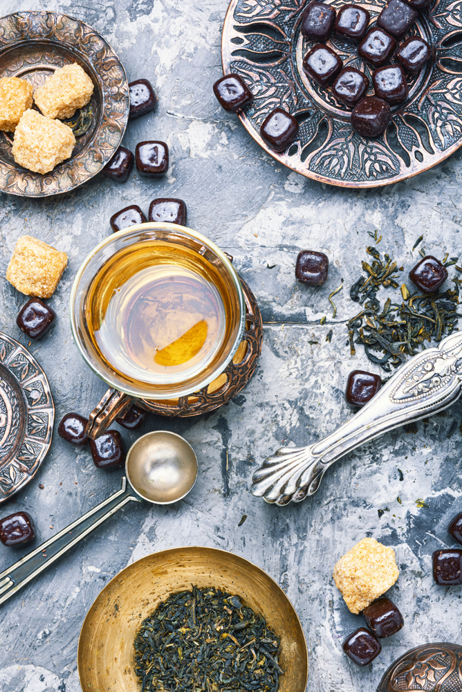 Cups of turkish tea with oriental sweets.Eastern tea. Turkish tea in traditional glass