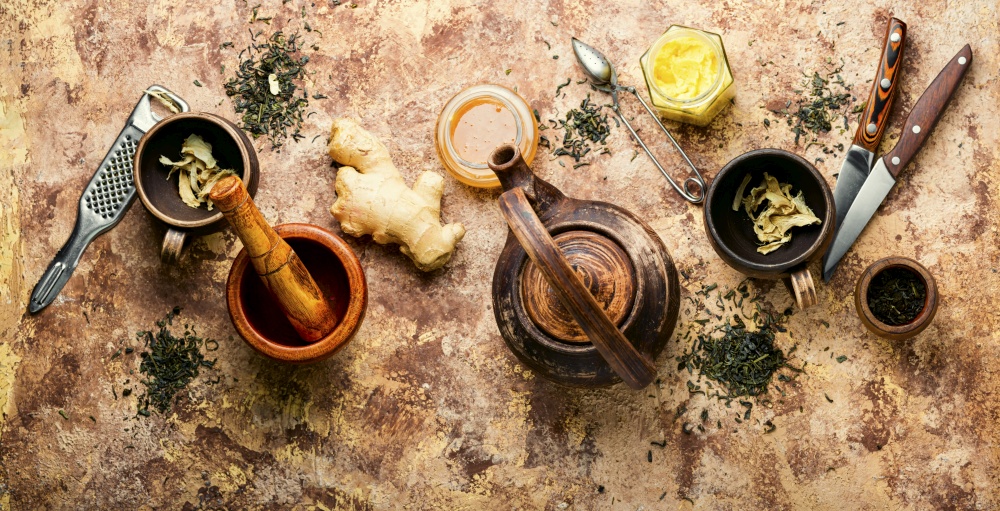 Teapot with tea made from ginger,honey and lemon.Vitamin, healing tea. Ginger root tea