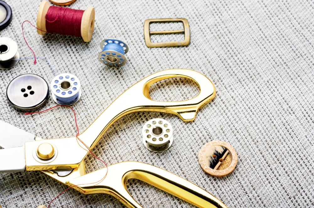 Set of buttons, threads and other sewing accessories.Tools for sewing. Set sewing accessories