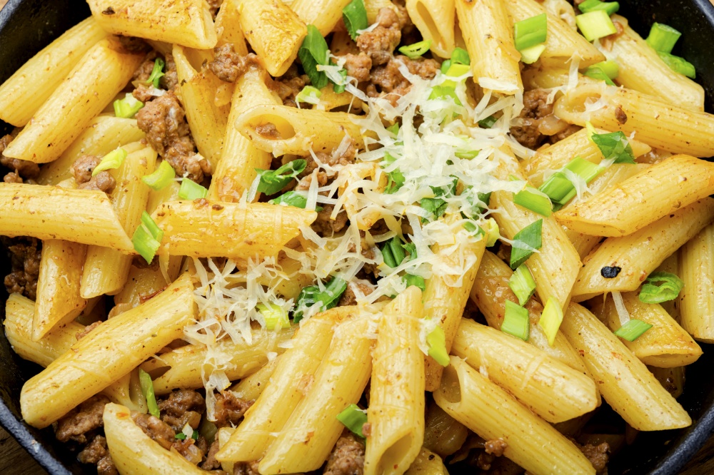 Pasta with fried minced meat.Food background,close up. Appetizing pasta with minced meat