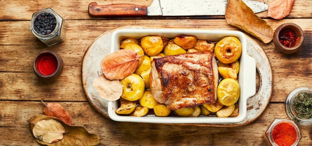 Loin stew with fruit.Baked meat with apples in baking dish. Baked pork with apples