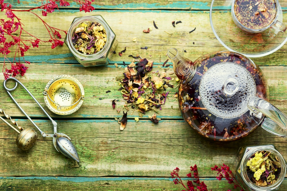 Healthy flower tea in a glass teapot.Natural herbs medicine. Delicious herbal tea