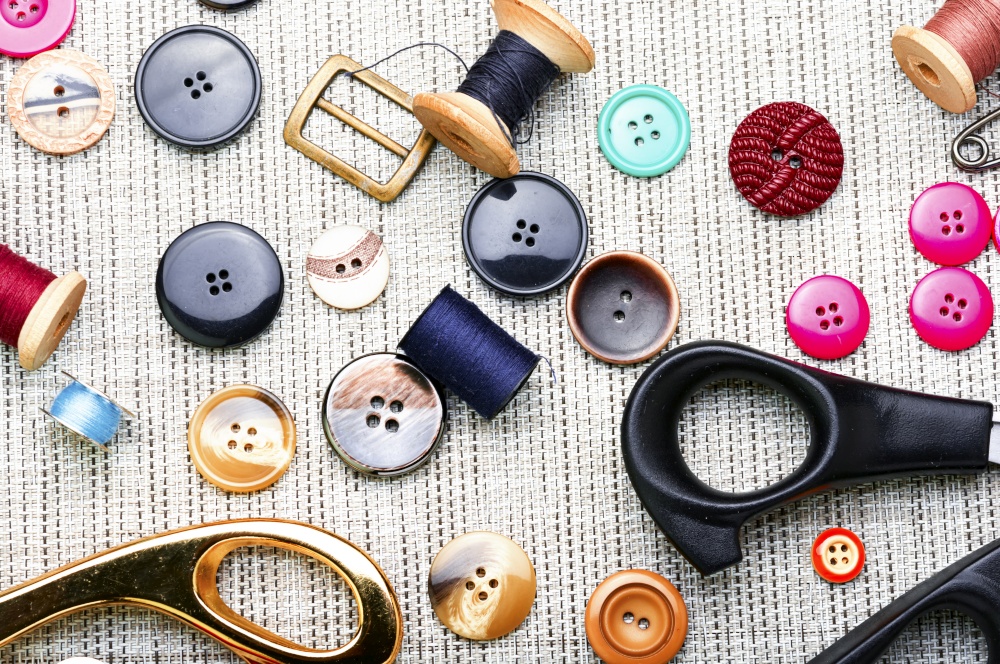 Set of buttons, threads and other sewing accessories.Tools for sewing. Set sewing accessories