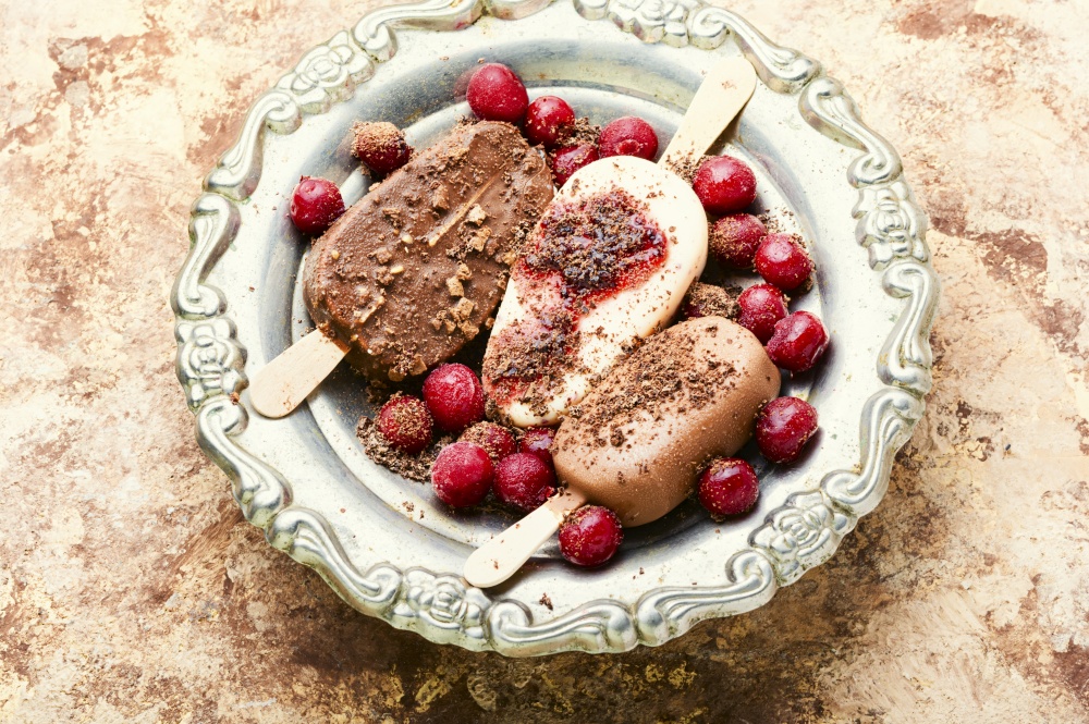 Popsicle ice cream with chocolate and cherry.Ice cream sticks. Chocolate ice cream on a stick