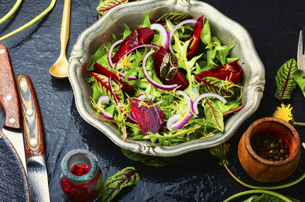Green vegetarian salad made from beets and greens.Vegan menu.. Spring green salad,healthy eating