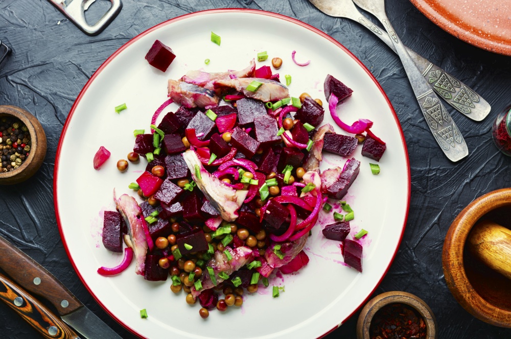 Salad with herring,beets,onions and green peas.Traditional russian salad. Appetizing herring salad