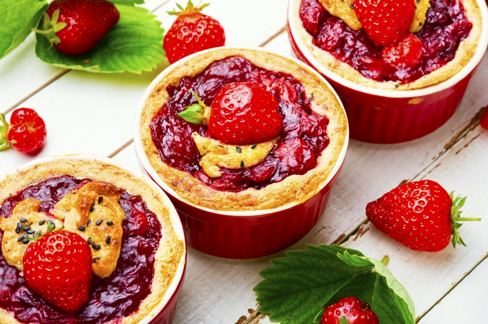 Delicious tartlets with berry jam.Cake with strawberries.. Summer tartlets with strawberries