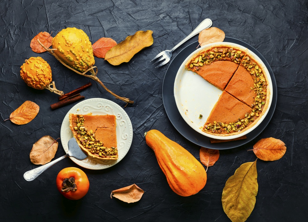 Fresh homemade pumpkin pie.Pumpkin tart.Thanksgiving pumpkin cake.Top view. Homemade autumn pumpkin pie,flat lay
