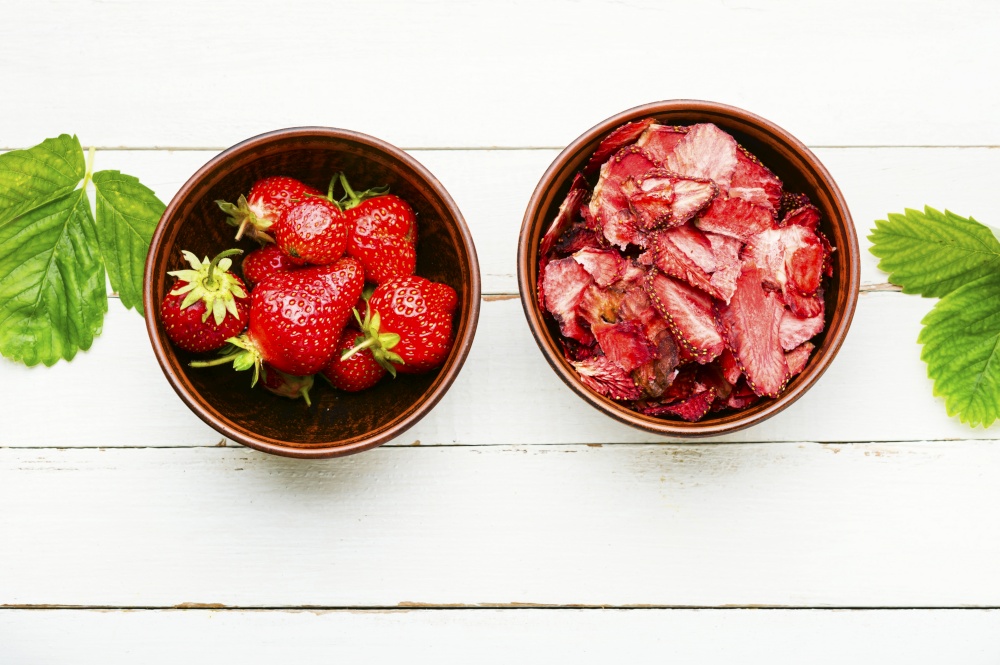Dried summer berry,fruit dessert.Strawberry chips,berry sweetness.. Fruit strawberry chips,white background