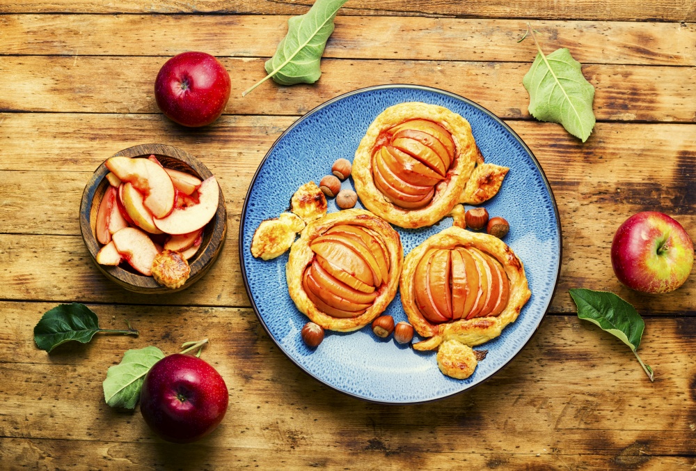 Autumn homemade apple pie.Small apple mini pie.Fruits baked in dough.. Apple mini pie