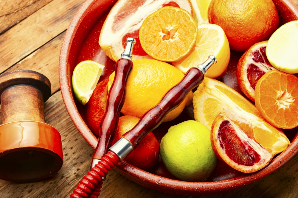 Fragrant smoking hookah or shisha with tobacco from citrus fruits.. Hookah or kalian with citrus tobacco.