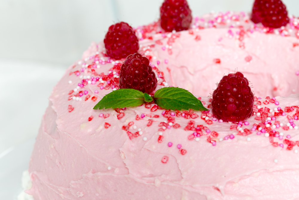 Gugelhupf cake with pink buttercream and raspberries.. Gugelhupf cake with pink buttercream and raspberries