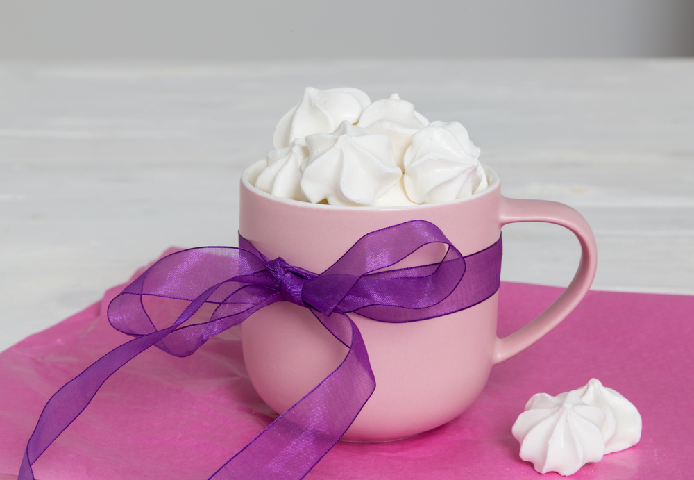 Sweet meringue in cup as a gift.. Sweet meringue in cup as a gift