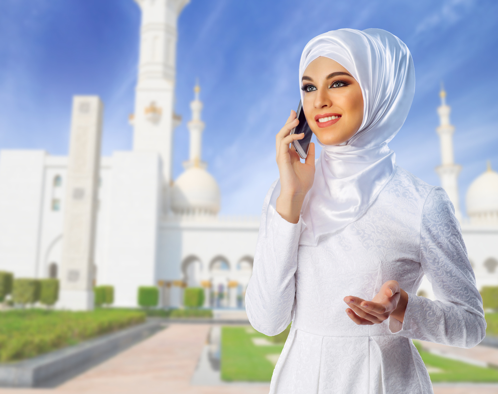 Young muslim woman on mosque background