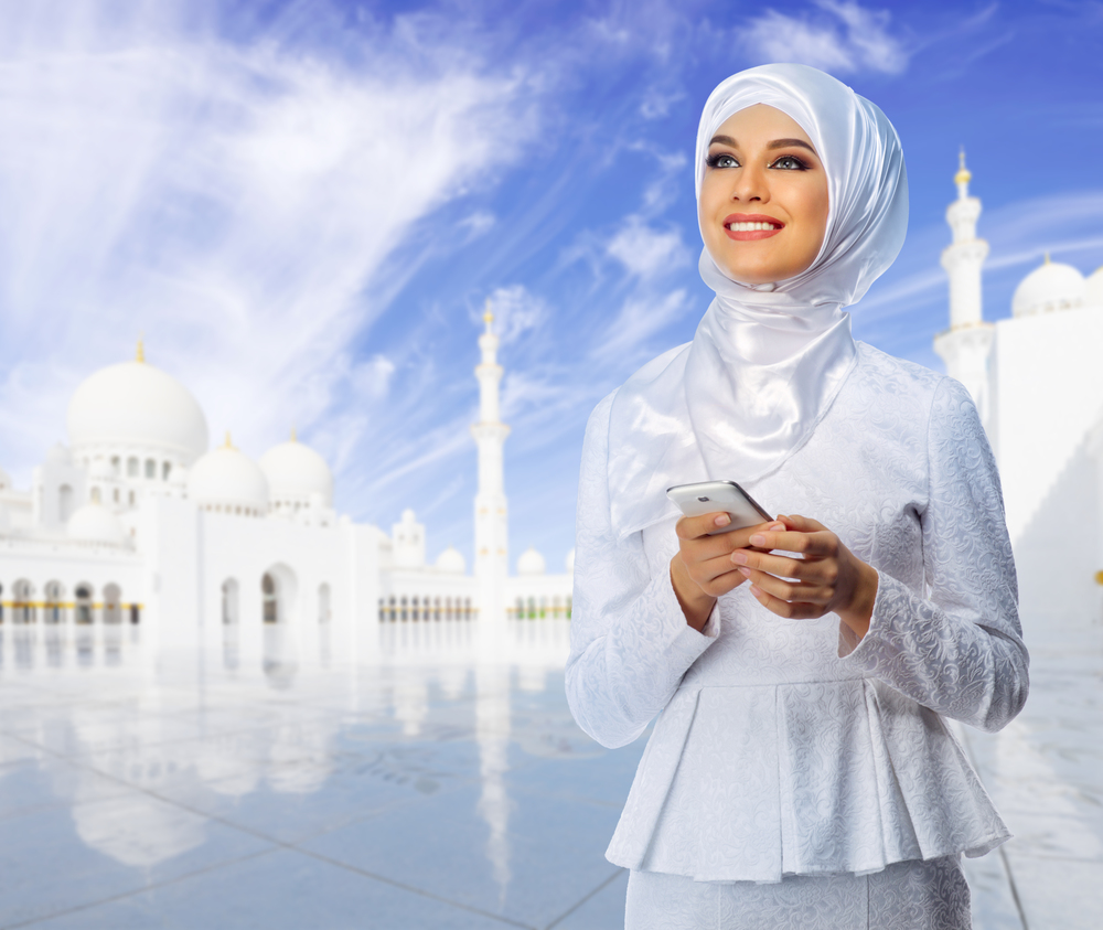 Young muslim woman on mosque background