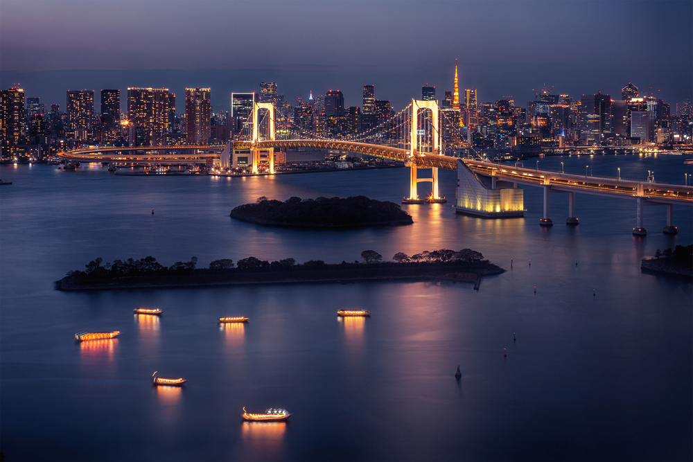 Tokyo skyline with Tokyo Tower and Rainbow Bridge at night in Tokyo, Japan. Tokyo skyline with Tokyo Tower and Rainbow Bridge at night in Japan