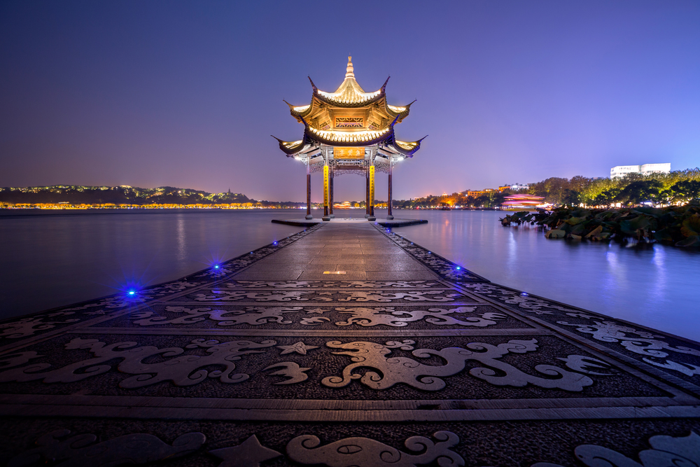 illuminated ancient Jixian Pavilion at West Lake, Hangzhou, China. ancient Jixian Pavilion at West Lake, Hangzhou, China