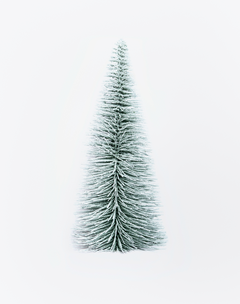Decorative artificial Christmas fir tree on  white background