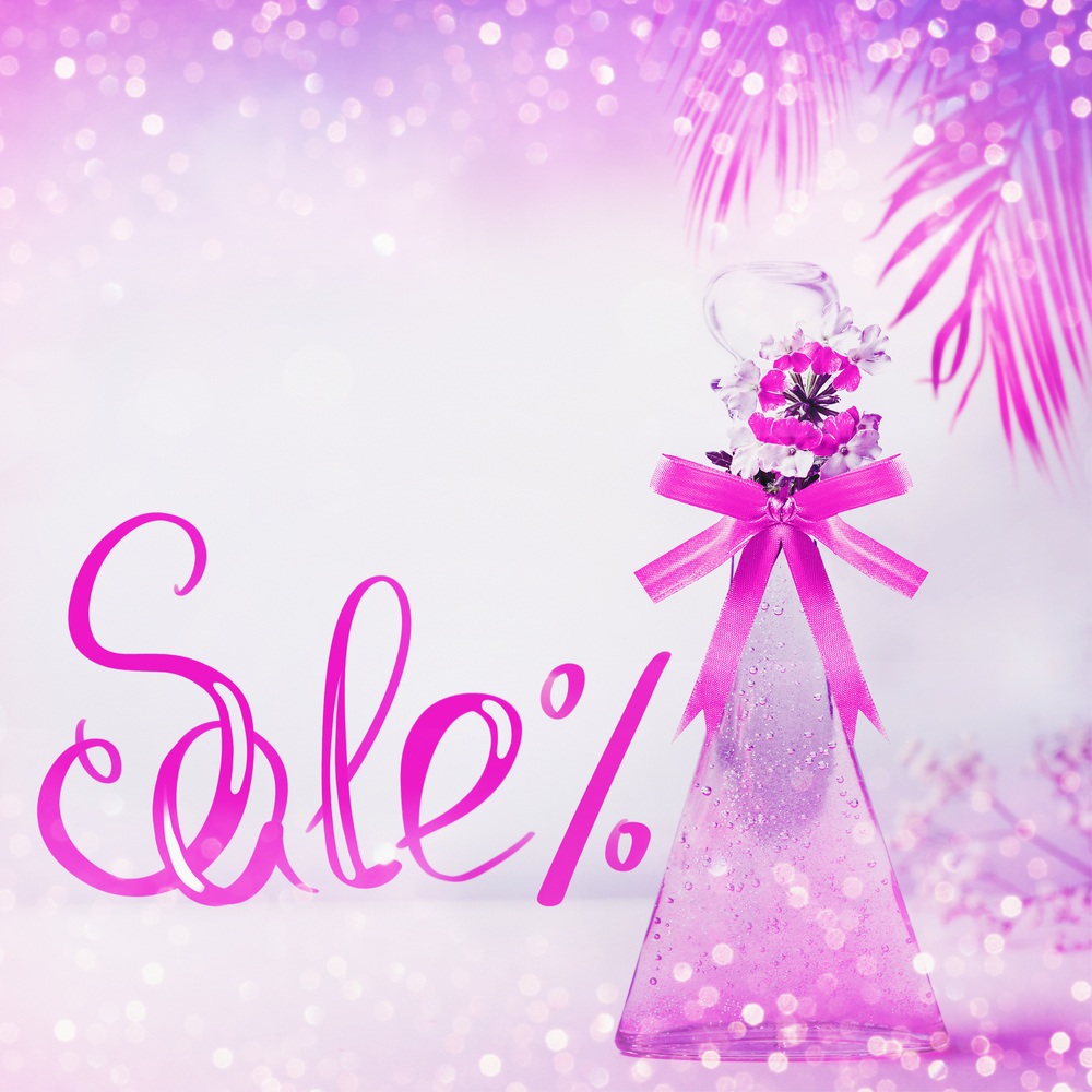 Cosmetic , Sale text lettering. Product glass bottle with in neon color with ribbon ,flowers and hanged palm leaves standing on pink background. Skin care, cosmetic shop and abstract beauty concept