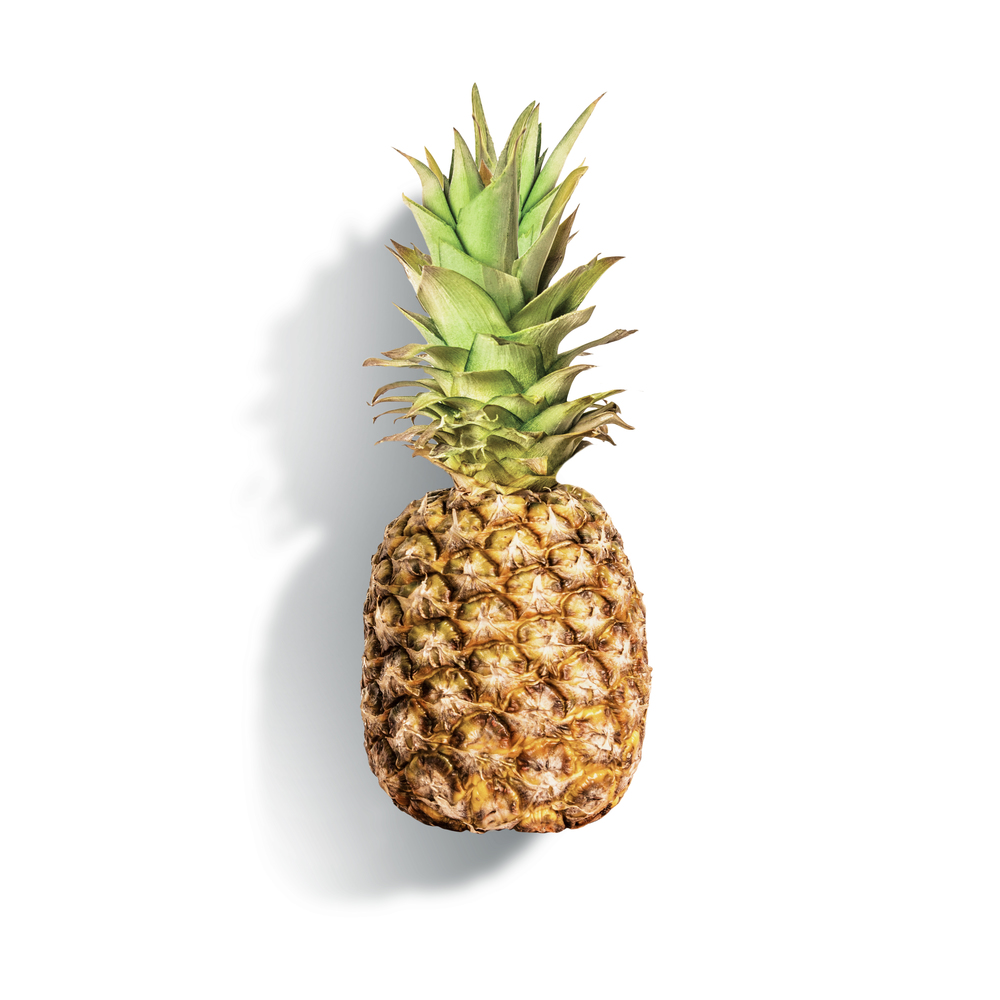 Pineapple at white background. Summer tropical fruits concept. Copy space.  Copy space for your design. Isolated